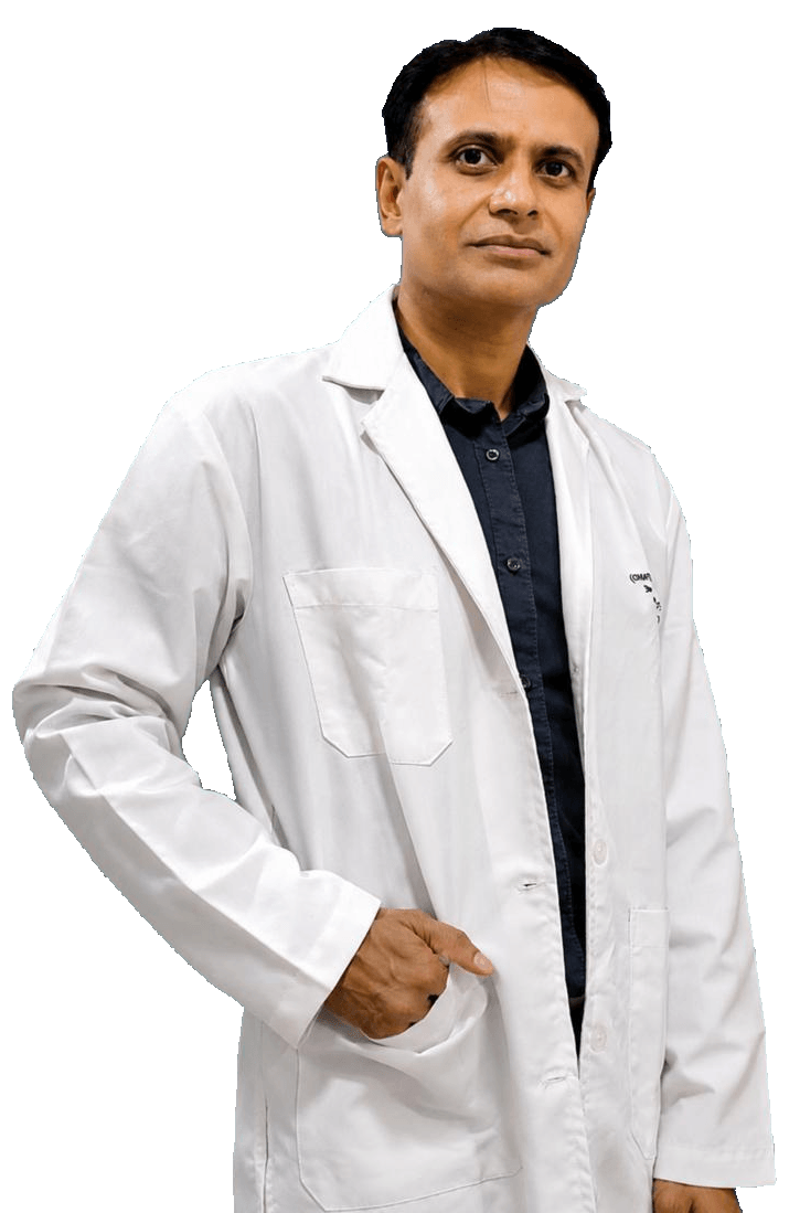 Dr Sandeep Mahapatra in a white coat, one hand resting on his hip