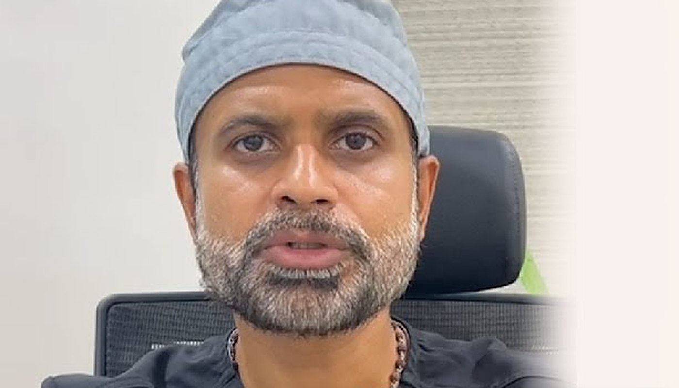 Dr Sandeep Mahapatra speaking to camera in the clinic