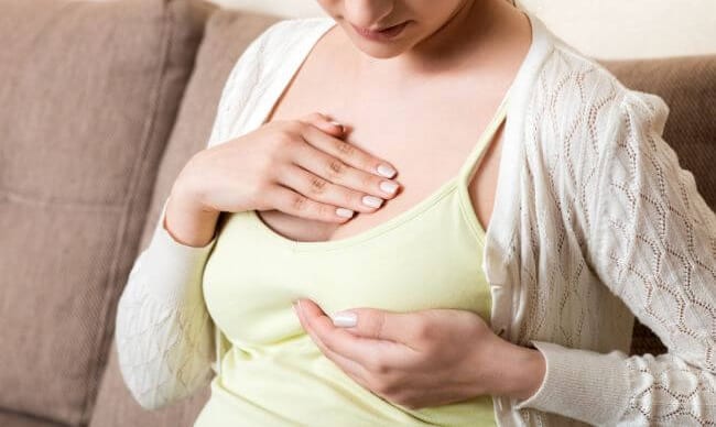 Woman considering breast surgery