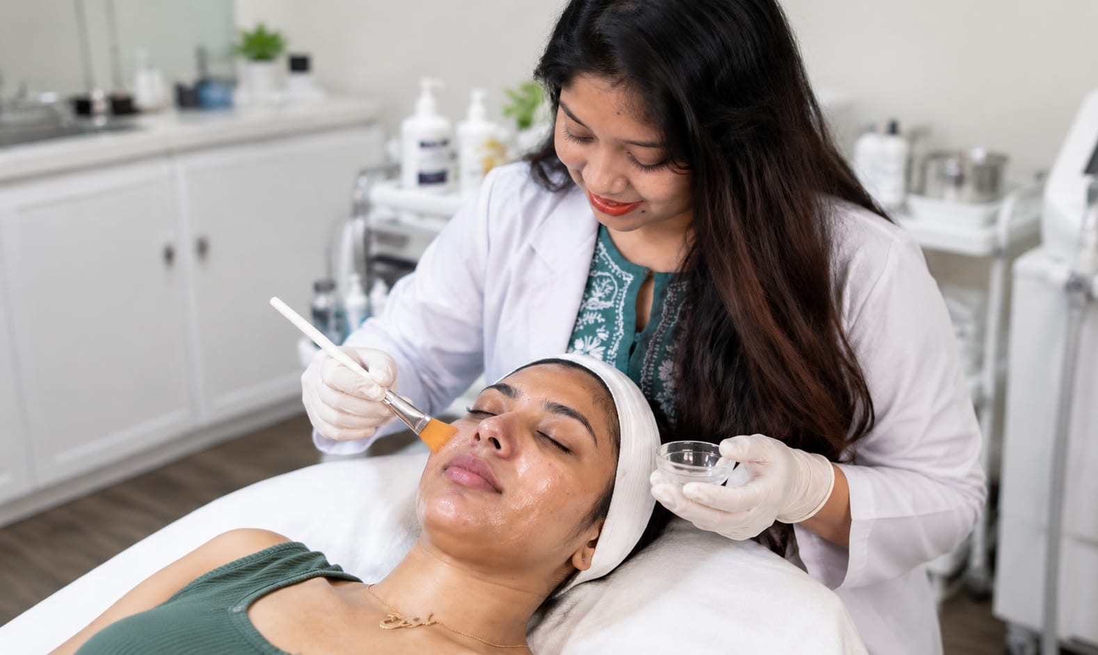Dermatologist applying a chemical peel at Derma Solutions